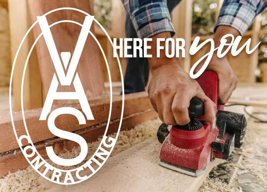 carpenter using a red sander to smooth wood